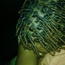 My hair the night I got it loc- you can see the gel and beeswax used to help them set.. It looks long but it's not