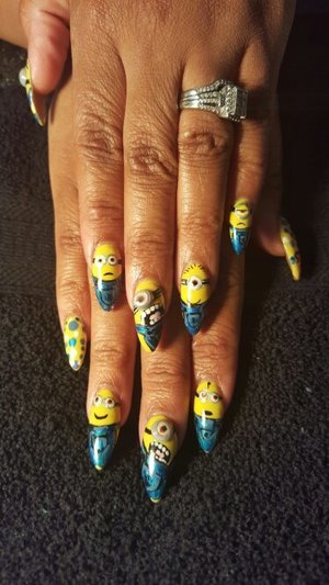 yellow and blue minion designed nail art
