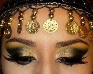 Traditional arabic makeup in gold green and black