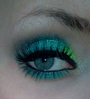 A glittery green look using the Coastal Scents 78 shadow blush palette, in addition using the dark gray eyeshadow from the Coastal Scents go paris palette. 
 
Used a low quality glue to seal the glitter on my eyelid. 
The mascara is the l'oreal double extension mascara. 
The eyeliner is also from l'oreal. The liquid liner is by make up academy.