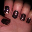 Black nails with pinkish/maroon glitter 