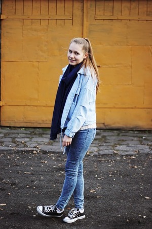 Light-blue coat, featuring detachable two piece design, long sleeve styling, buttoned front, double symmetric pockets on the front with flapped decoration, loose fit, soft touch fabric, regular length. Mixed with denim shorts and flat shoes for shopping with friends.