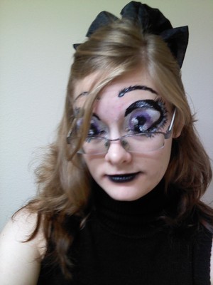 Anything is possible with eyeshadow, liguid eyeliner, and leftover white face cream from halloween!