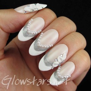 Read the blog post at http://glowstars.net/lacquer-obsession/2014/10/a-french-mani-with-silver-glitter-pearls-and-3d-flowers/