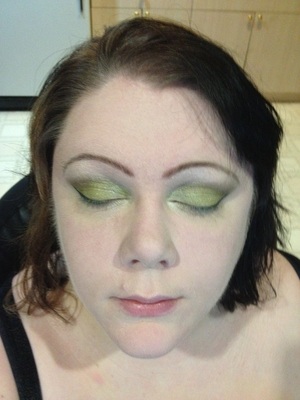 I'm using another green, here, and going for the cat-eye look, though in a subtle way. I wear the cat-eye look every day, in some way of another. This just adds a bit of finish to the makeup already in place.