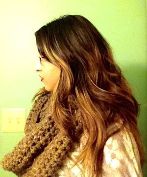 A gold, reddish brown base ombré with honey blonde highlights