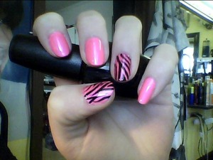 I used OPI's "My Boyfriend Scales Walls" white polish as a base, China Glaze's "Pink Voltage" polish for the color. and just used a black striper to free-hand the zebra stripes. I thought this was really cute, and i enjoy it. <3 (i broke my thumb nail, and now it's all nubby. :/)