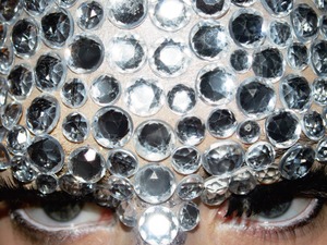 This is one of my rhinestone 'Glitterface' looks. It takes ages, but it's worth it, especially for on stage. I prepare my forehead with a bass of silver shimmer so the space in between each rhinestone still has a bit of sparkle and then apply the rhinestones one by one using the eyelash glue from my lashes.