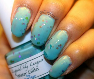 Two generous coats of Liquid Sky Lacquer Water Lillies, plus topcoat. According to her website, this is a teal crelly with small and medium purple hex, fine neon green sand, medium holo green hex, large green hex, large bronze hex, and large blue hex. :) Very pretty.
