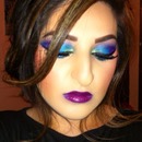 Blue and purple eye makeup with plum lips 