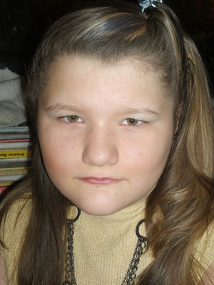 November 2011 (age 11)  - I think KyChina was less then thrilled this day with me flashing the camera....we just did a little twist with the hair and a light touch of color for a more natural look w/ her make up.