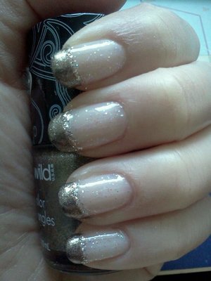 Different kind of French manicure with a bit of sparkle.