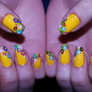 Spring flowers on yellow nails