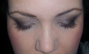dark smokey eye with thick lashes and suttle cheeks