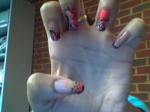 Used a coral, nude, pink sparkle, and black acrylic paint for these nails.