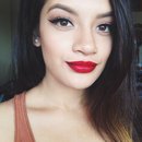 Full face of the Simple Winged Liner with a bold red lip