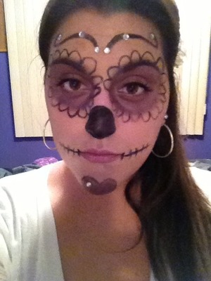 A Halloween look that was inspired by the Spanish holiday of the day of the dead. I added my only little twist to it by using my favorite color purple, and by adding some rhinestones to give it a more glam appearance.
