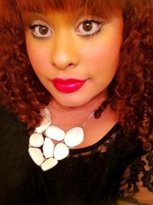 Soft pretty makeup, with winged liner and a bold fuschia lip.