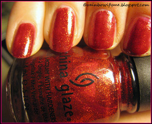China Glaze's Ruby Pumps.
Please read my honest review about the nail polish here:
rainbowifyme.blogspot.com/2011/10/china-glaze-ruby-pumps.html