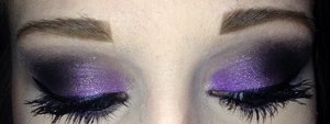 This was a practice run for my sister's prom makeup. I first primed her eyelids, then put down a purple cream base one the inner 2/3 of her eye and a black cream base on the outer 1/3 of her eye. I then took a bright purple eye shadow over the purple base and a black eye shadow over the black base and blended. to top it off  added purple sparkles, eyeliner, and mascara.