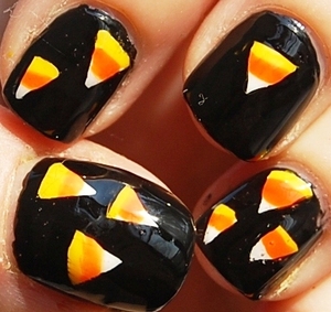 Candy Corn Halloween Nails (Halloween Series #1) 
tutoriaL: http://www.youtube.com/watch?v=1fUkXSuxaOo
blogpost: http://misstouver.blogspot.com/2011/10/candy-corn-halloween-nails-halloween.html