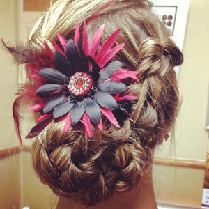 2 French braids twirled in a bun with a flower :) 