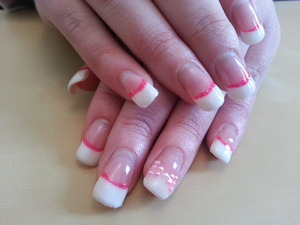 french polish gellux over gel extensions with pink glitter and a pink gem bow! I think there so cute!!