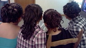 This picture is of a mother and her three daughters. My friend and me did their hair for a party. All of them have twists from front to back. The rest is updos & curls. :)