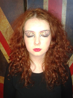 leopard print eyes with a hint of colour and glitter and a red lip to match! skin makeup also applied.