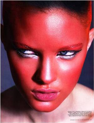 red face paint, silver eyeliner, pink glossy lips, avant garde