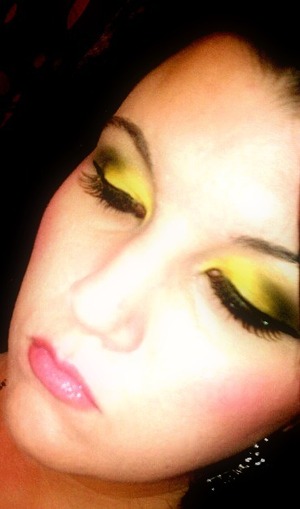 yellow and black eyeshadow with false lashes
