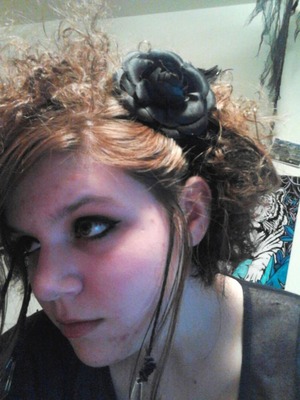 I think I had 4 flowers in my hair this day. You can only see one here, though. I have my side burns in micro braids with crystals hanging from them, as well. My hair really isn't long at all. It barely hits my shoulders.