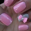Barbie pink nails with bow accent nail.