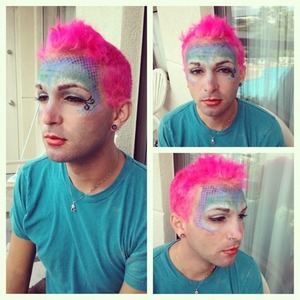 To get this look, I used urban decay poison primer. Then I took fish net stockings to make the scale look. Didn't do his hair. This was my first big project and this was just my practice on him! 