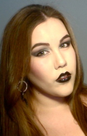 Goth looking,,, experimenting with black lipstick 
