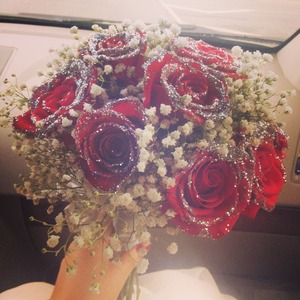 12 red roses dipped in silver glitter! 