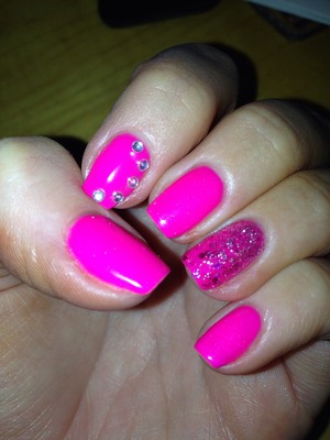 Neon pink sparkly nails 