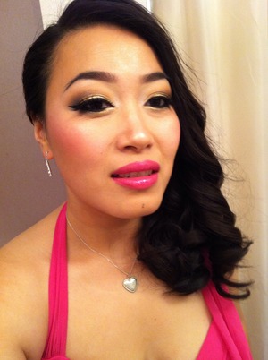 My golden eyes went well with my vibrant pink dress for a beachy wedding. 