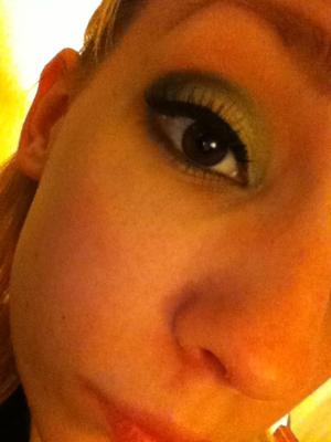 Green smokey eye with false lashes.