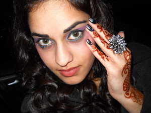 New years! i did the make up by myself and the nails. :) i used the elf pallette for the purple eyeshadow, and used hard candy black eyeliner and the turquoise under the eye. and my nails were painted black with half shatter and half jewels