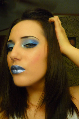 Silver and bright blue on lid, hint of pink on cheek and metallic lips