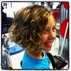Such a cute with her a-line bob and fabulous feather!