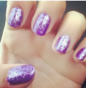 I just simply painted my nails dark purple and used a glittery polish! Simple and cute!