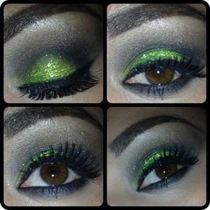 green eyeshadow with matching loose glitter and eyelashes