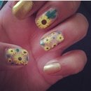 Cute sun flower nails with gold 