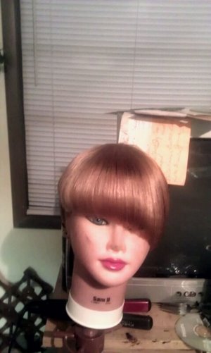 This is the mannikin that i was trying to get the red out of. cant tell my the pic but she is a champagne blonde. cut and style