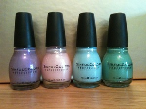 These are some of my favorite Sinful Colors nail polishes. The purple is Jasmine Jazz 251, the pink is Glass Pink 776, the blue is Cinderella 1106, and the green is Mint Apple 947. :)