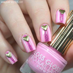 Read more on my blog here: http://www.nails-by-erin.com/2015/02/valentines-day-nails-pink-stripes-with.html

And watch my 15 second tutorial here: https://instagram.com/p/zIYTfksJ2B/?taken-by=nails_by_erin