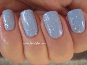 Essie Bikini So Teeny with China Glaze Fairy Dust and Picture Polish Glitter Ball on top. 

http://wickedlovelylacquer.blogspot.com/2012/11/pretty-pastels-for-winter.html