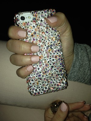 Nude pink nails with Swarovski crystal case.